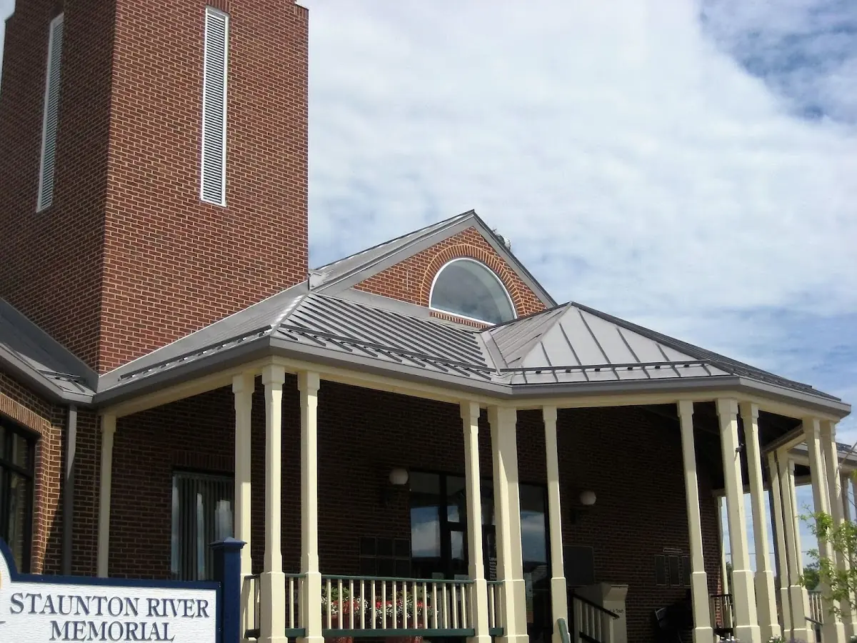 Skilled roofing craftsmen working on a residential roof in Perryville